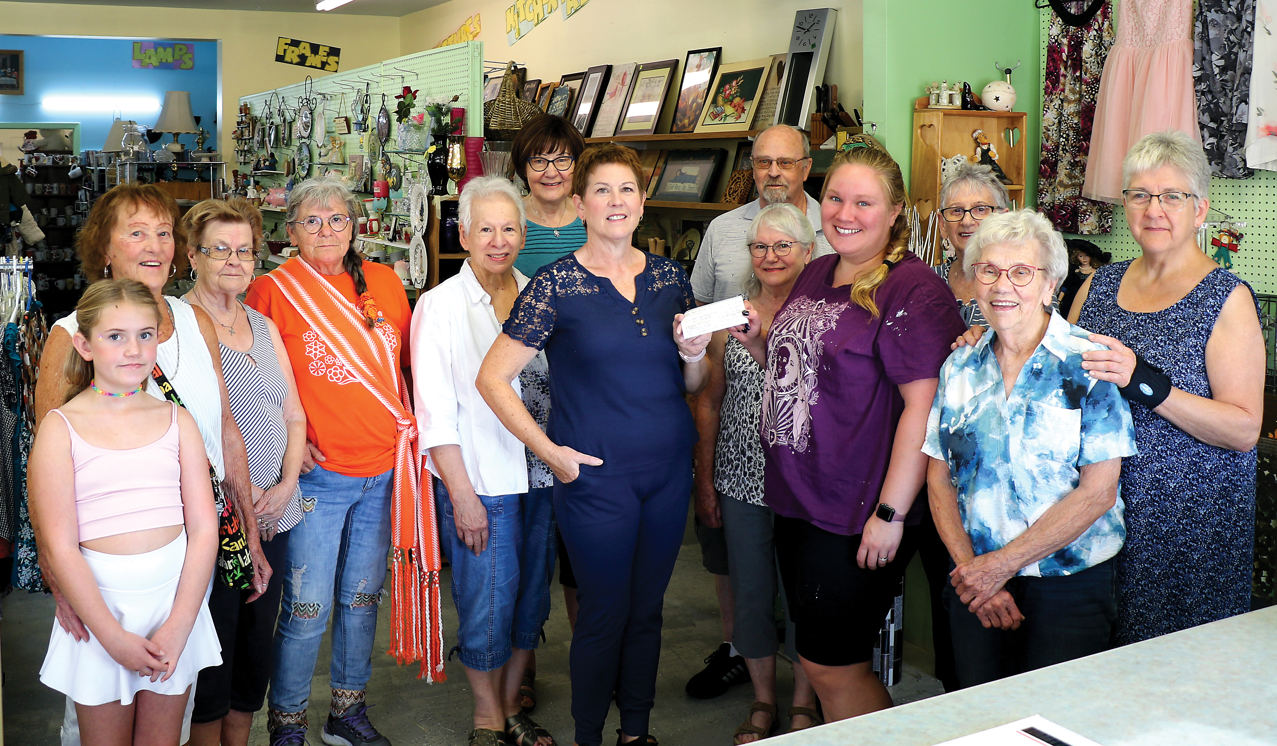The Rocanville Thrift Store board presenting a $10,000 cheque to Kelsey Selby of the Rocanville Aquatic Centre.